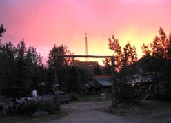 midnight sun behind gate.jpg