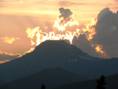midnight sun behind mountains.jpg