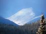 snow on mountains behind cabin.jpg
